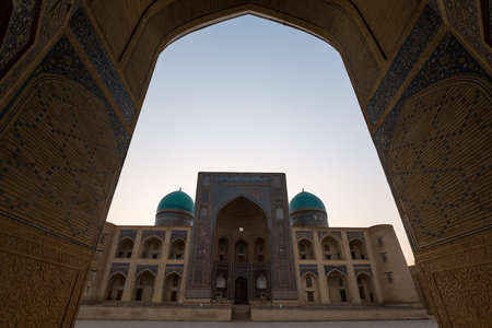 BUKHARA, UZBEKISTAN - APRIL 12, 2022: The Mir-i-Arab Madrasah of the Po-i-Kalyan Complex in Bukhara,...