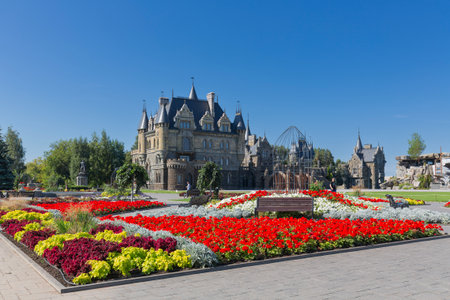 HRYASCHEVKA VILLAGE, SAMARA REGION, RUSSIA - AUGUST 01, 2023: General view of Garibaldi Castle on a sunny summer day with beautiful flowerbeds in the foreground. A popular tourist attractionのeditorial素材