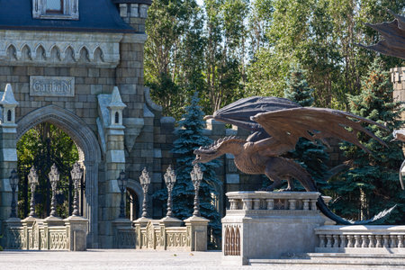 HRYASCHEVKA VILLAGE, SAMARA REGION, RUSSIA - AUGUST 01, 2023: A bronze statue of dragon in front of the entrance of Garibaldi Castle complex, Samara region, Russia. Summer travel vacationsのeditorial素材