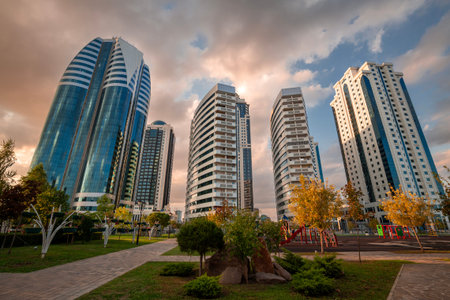 Sunset view of flower park and buildings of Grozny-City, a skyscraper complex in Grozny, located in...
