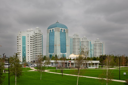 SHALI, CHECHEN REPUBLIC, RUSSIA - SEPTEMBER 23, 2023: The Shali City Hotel and tall modern buildings in the city center at cloudy day. Travel in North Caucasusのeditorial素材