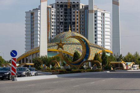 ARGUN, CHECHEN REPUBLIC, RUSSIA - SEPTEMBER 23, 2023: Cityscape of city Argun with car traffic, crecsent moon and Aimani Kadyrova Mosque "Mother's Heart" in high-tech styleのeditorial素材