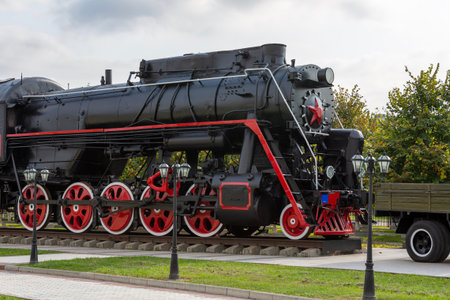 An old soviet steam locomotive in a garden and park ensemble of a memorial complex The Memorial of Memory and Glory  in Nazran, Republic Ingushetia, Russia
