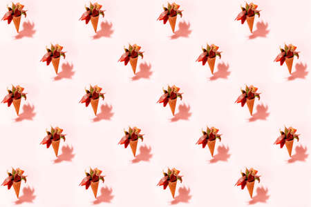 Standing ice cream cones filled with autumn leaves patternの写真素材