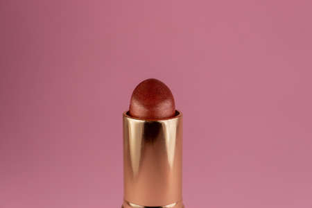 Close up studio shot of a dark red lipstick.の写真素材