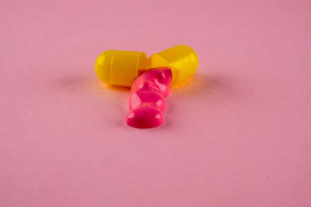 Creative layout of open pill with dripping paint. Macro shotの写真素材