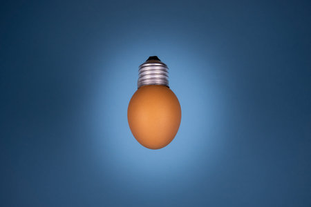 Egg lightbulb on deep black background. Creative idea concept