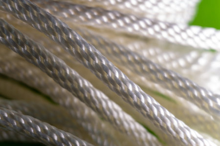 White rope macro shot on green background