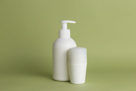 White plastic soap dispensers and deodorant. Copy space. Place for text.