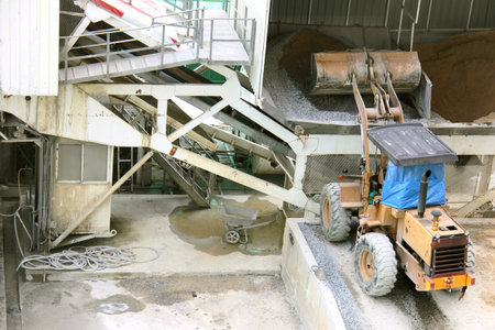 Wheel loader machine unloading sand in construction siteの写真素材