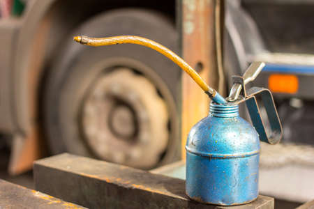 Old oil can in the garage の写真素材