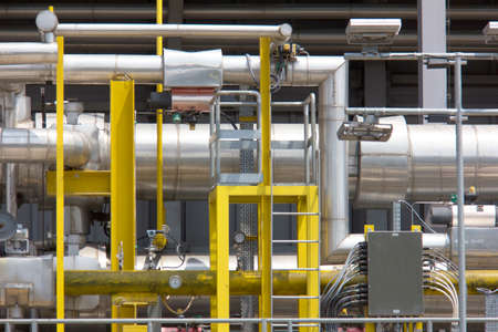Steel pipelines and cables of industrial power plant, Industrial zoneの写真素材