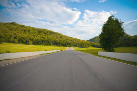racetrack straight to the mountain with the clear sky.の写真素材