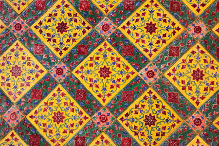 ancient ceramic tile decorated with Thai artの写真素材