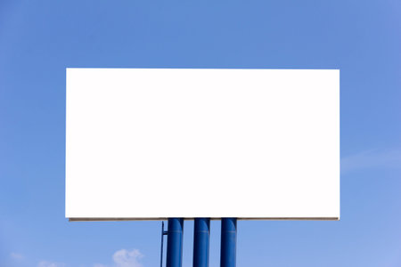 blank billboard for new advertisement against blue sky