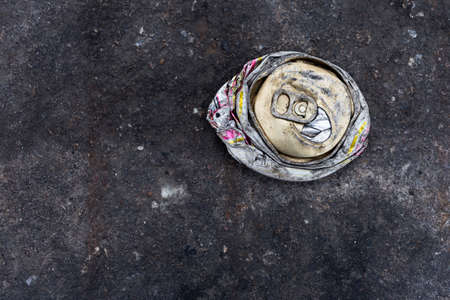 crushed can on the roadの写真素材