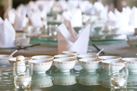 chinese table set for catering at banquet room in the restaurant, selective focusの写真素材