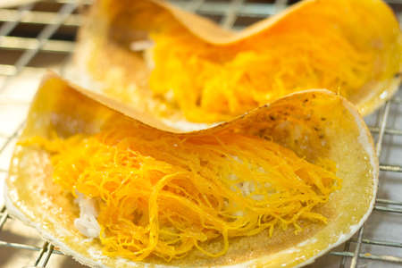 thai crispy crepe as dessert, Thai sweet with coconut milk and eggs, similar to a small crepe.の写真素材