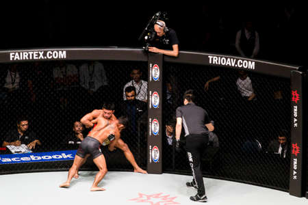 Bangkok, Thailand. - January 17, 2018 : unidentified boxers are fighting in cage ring extreme sport mixed martial arts (MMA) match at One Championship competition tournament in Bangkok, Thailand.のeditorial素材