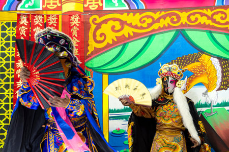 Ayutthaya, Thailand - January 8, 2020 : Unidentified Chinese opera actors performs traditional drama and shows mark face-changing on stage in Ayutthaya, Thailand.のeditorial素材