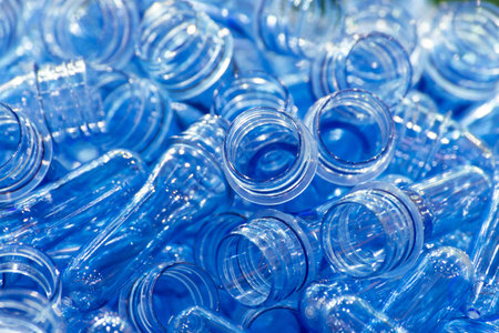 group of blue transparent plastic PET preforms is ready to produce for water drink packaging plastic...