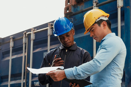 professional engineer and businessman checking and inspect containers in international cargo at ...