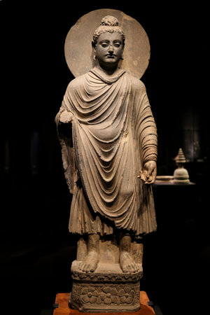 ancient standing Buddha schist statue image in 2nd-3rd century, Kushan dynasty from near Peshawar,...