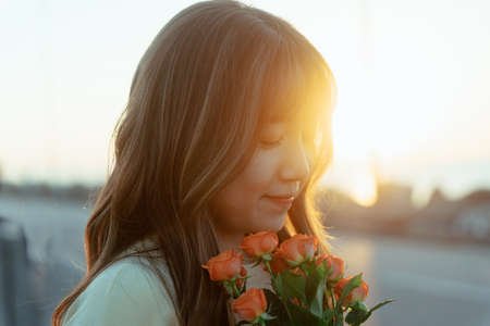 A girl enjoying the sunset near the airportの写真素材