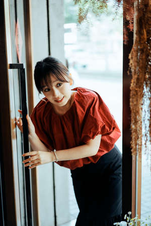 A girl exploring happily in a flower shopの写真素材