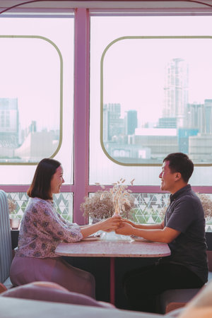 Couple having some drinks and enjoying their vacation.の写真素材