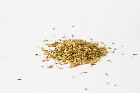 pile of fennel seeds isolated on white backgroundの写真素材
