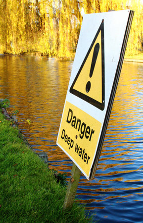 Deep water danger sign at the river