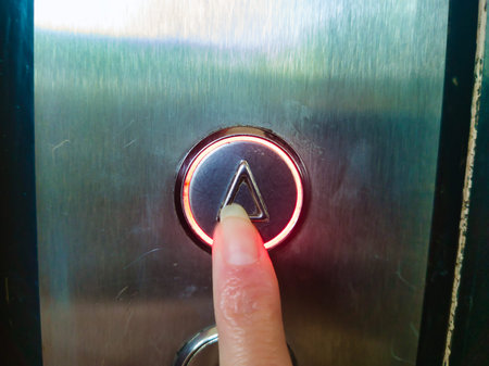 Person Pressing Elevator Up Button in Budapest Ors vezer tere Panelhaz