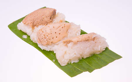 rice custard on leaf background whiteの写真素材