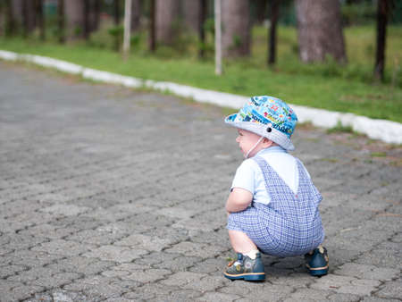 Young mother with her toddler son playing outdoors in city.の写真素材
