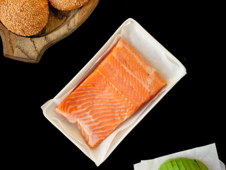 salmon steak on black backgroundの写真素材