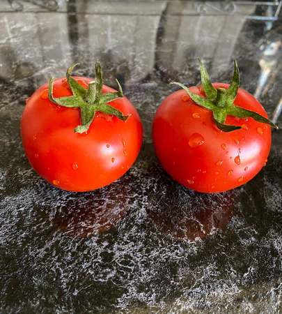 red tomato in waterの写真素材