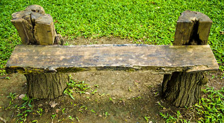 Old wooden chair on the lawnの写真素材
