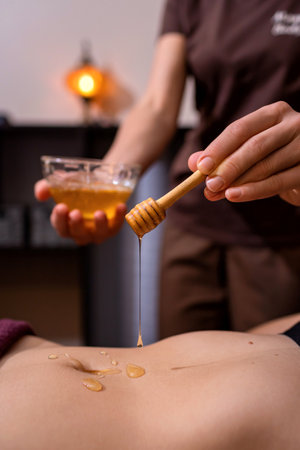 Cosmetology. Close-up of the ingredients of the honey spa and salt spa. The concept of spa treatments and body care.の写真素材