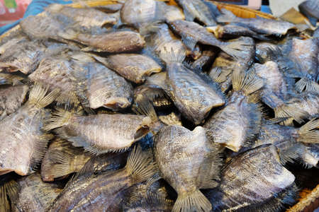 Salted fish is a dry food. . Fish marinated in salty sauce and dried in the sun to preserve food ,Thai style.Close up and top view.の写真素材