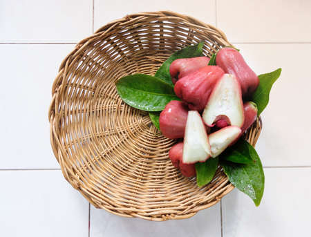 Fresh rose apple in a basket placed.の写真素材