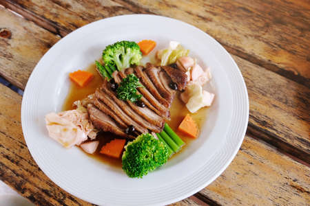 Duck breast in orange sauce .の写真素材
