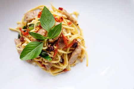 Pasta with dried chilli,garlic, sausage and thai basil on top. Thai style Pasta.の写真素材