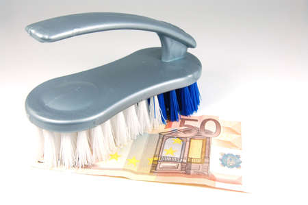 A Brush and a 50 euro bill isolated on white backround.の写真素材