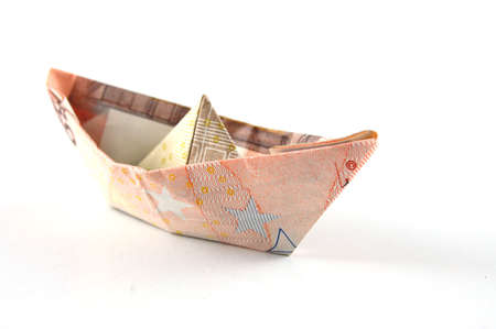 Ship made of money isolated on a white  background.の写真素材