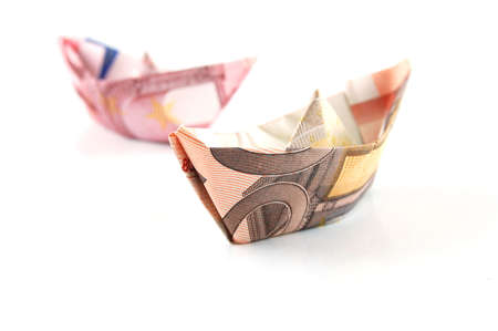 Ship made of money isolated on a white  background.の写真素材