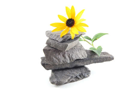 A tower made of stones isolated on a white background.の写真素材