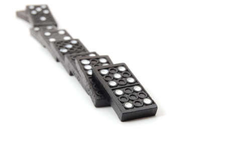 chain of dominoes isolated on a white backgroundの写真素材