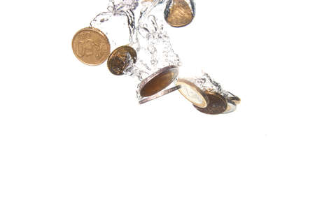 money in water with bubbles on white backgroundの写真素材