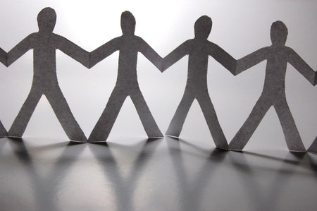 paper people doing teamwork in their businessの写真素材